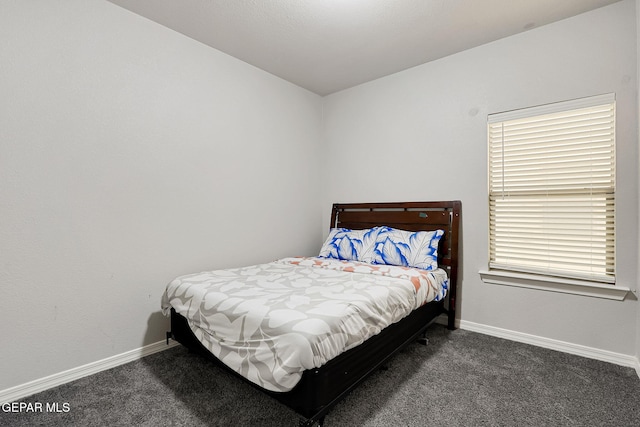 carpeted bedroom with baseboards