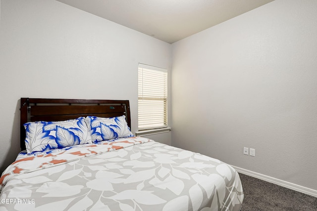 carpeted bedroom with baseboards