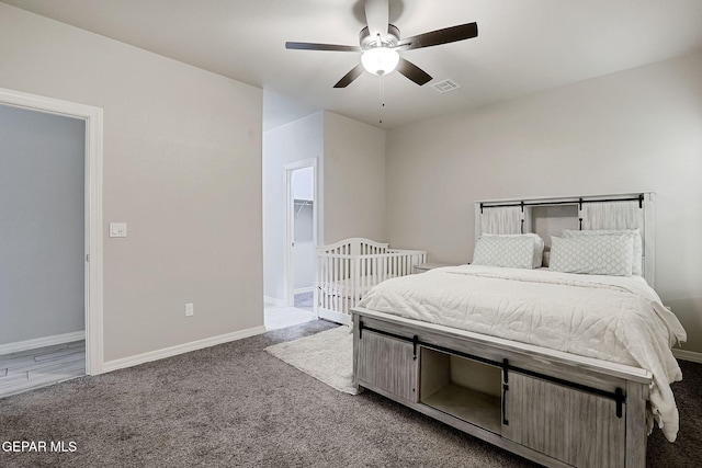 bedroom with a ceiling fan, baseboards, and carpet floors