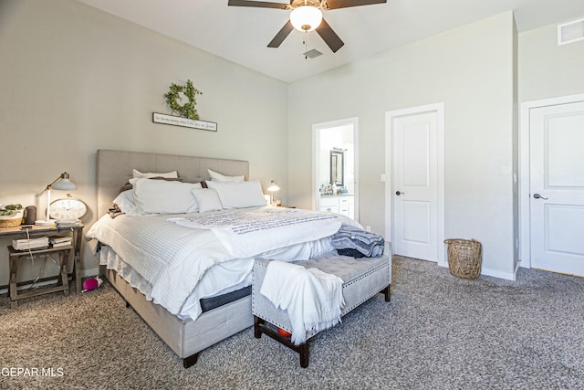 carpeted bedroom with visible vents, baseboards, and a ceiling fan