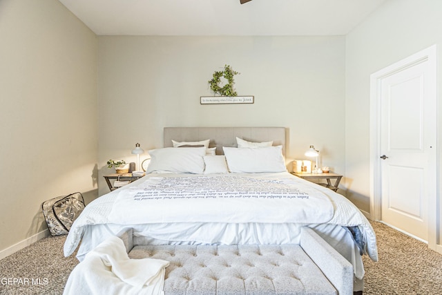 bedroom with carpet flooring and baseboards