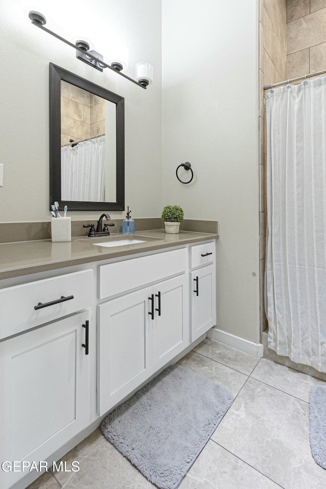 bathroom with vanity, tile patterned floors, and a shower with curtain