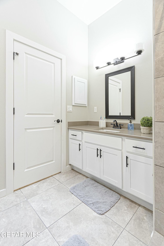 bathroom featuring vanity and tile patterned flooring