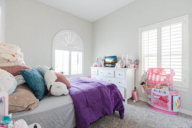 carpeted bedroom with baseboards