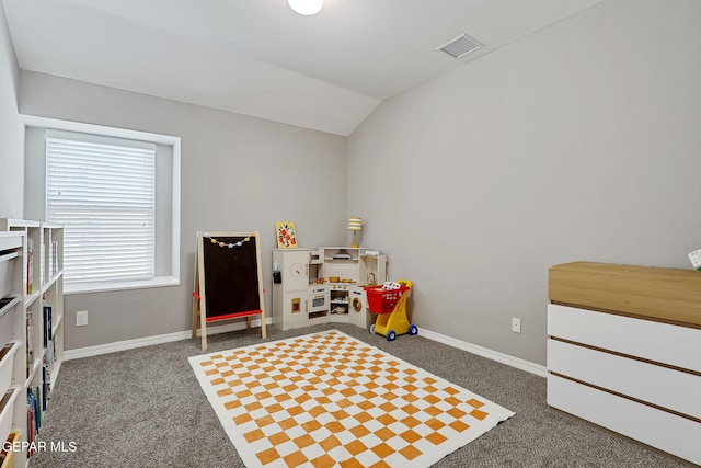 recreation room with visible vents, baseboards, carpet, and vaulted ceiling