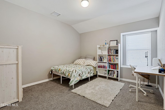 carpeted bedroom with lofted ceiling, baseboards, and visible vents