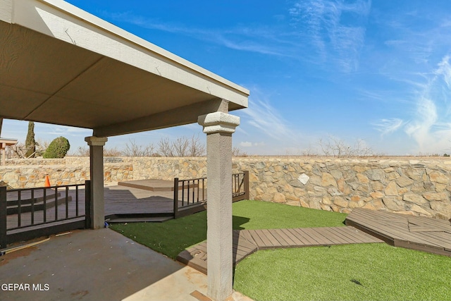 view of yard with a wooden deck and fence