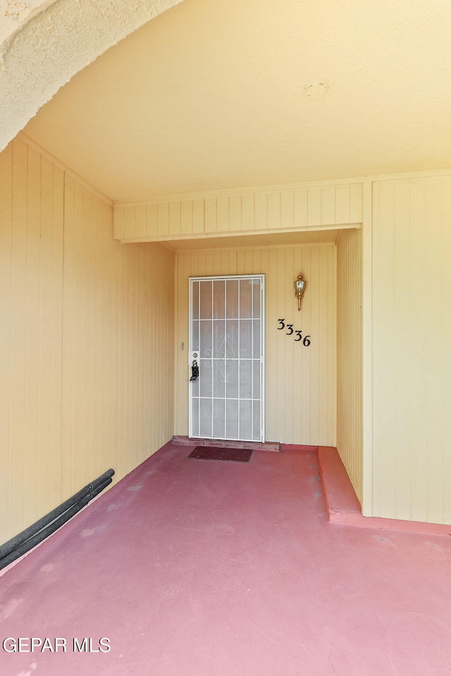 entrance to property with a patio area