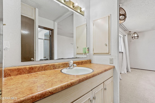 bathroom featuring vanity and a textured ceiling