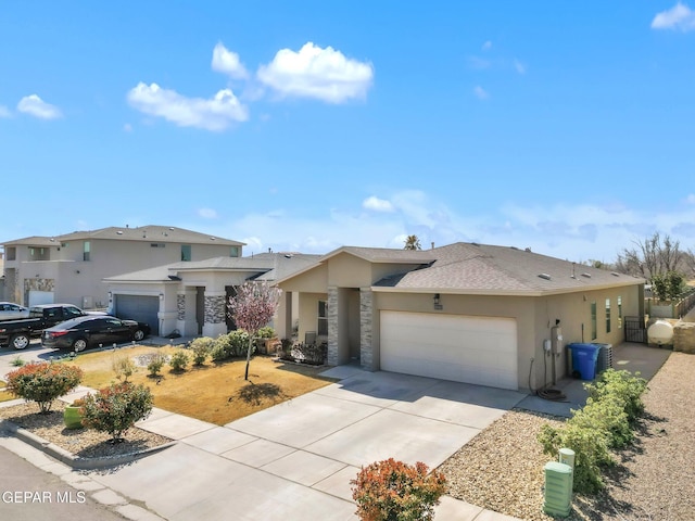 view of front facade featuring stucco siding, cooling unit, concrete driveway, and an attached garage