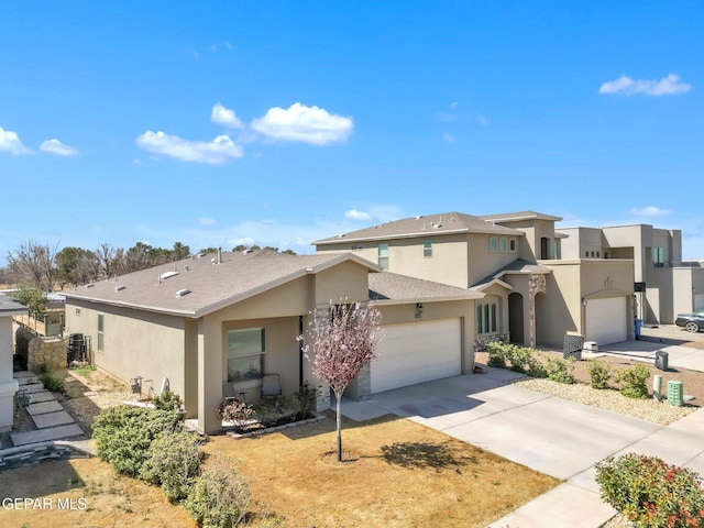 view of front of property featuring stucco siding, concrete driveway, a garage, and a shingled roof