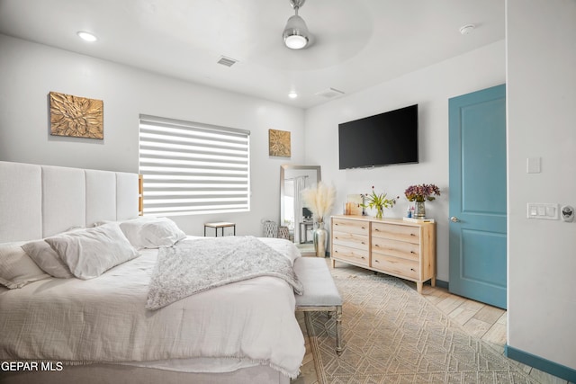 bedroom with recessed lighting, ceiling fan, and wood finished floors