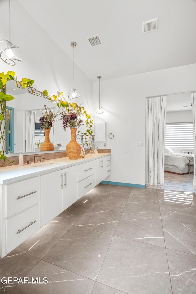 bathroom featuring vanity and visible vents