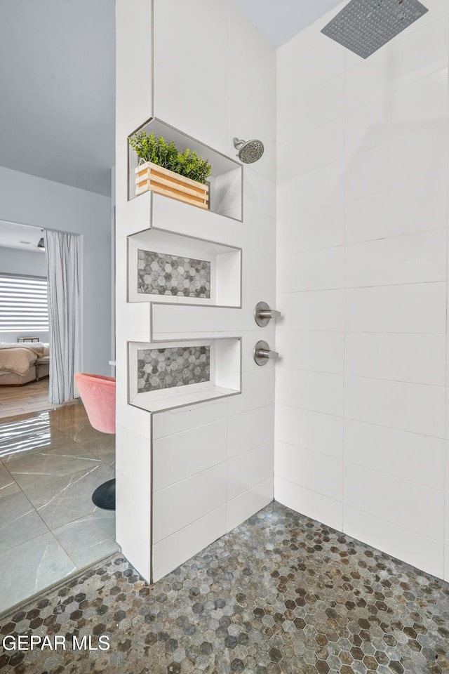 full bathroom with a tile shower