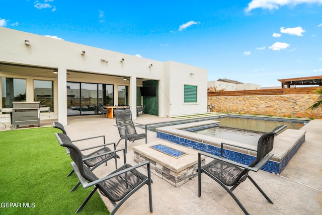 view of patio featuring an outdoor fire pit