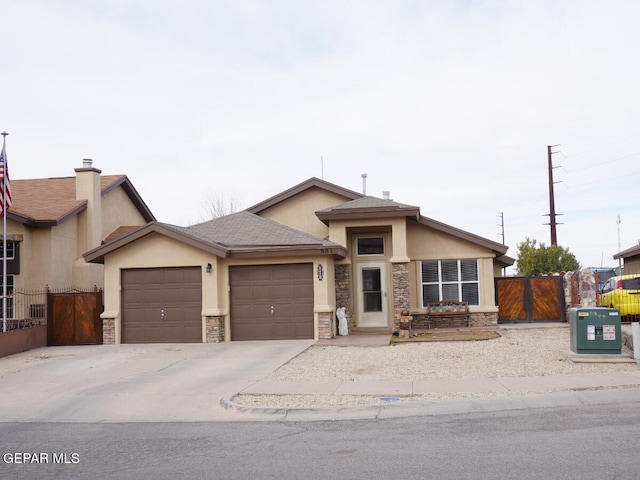 view of front of house with stucco siding, stone siding, concrete driveway, and an attached garage