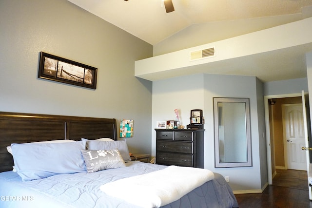 bedroom featuring visible vents, dark wood-type flooring, ceiling fan, baseboards, and vaulted ceiling