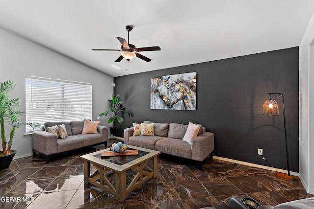 living area with vaulted ceiling, a ceiling fan, baseboards, and marble finish floor