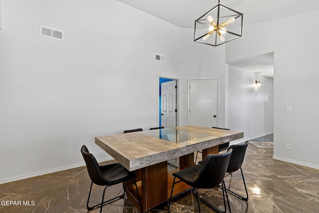 dining room featuring visible vents, marble finish floor, and baseboards