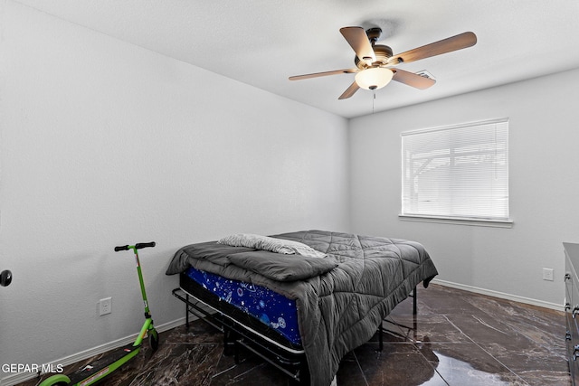 bedroom with baseboards, marble finish floor, and ceiling fan