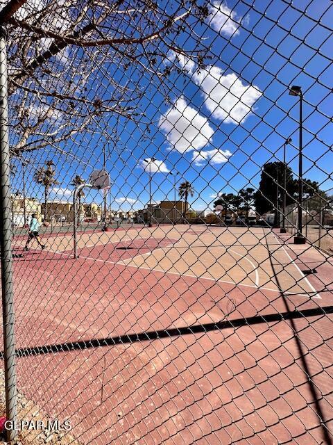 view of sport court featuring community basketball court and fence