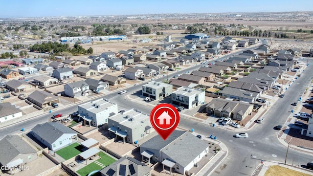 birds eye view of property with a residential view