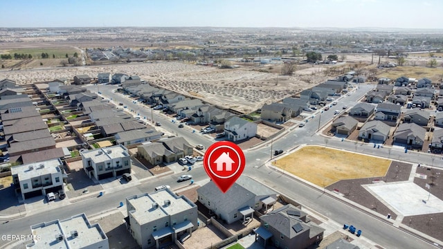 birds eye view of property with a residential view