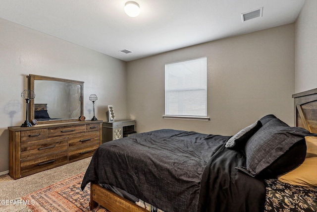 bedroom featuring carpet flooring and visible vents