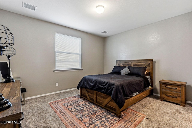 bedroom with visible vents, baseboards, and carpet floors