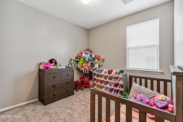 carpeted bedroom featuring visible vents and baseboards