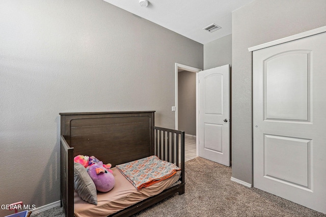 bedroom featuring visible vents, baseboards, and carpet flooring