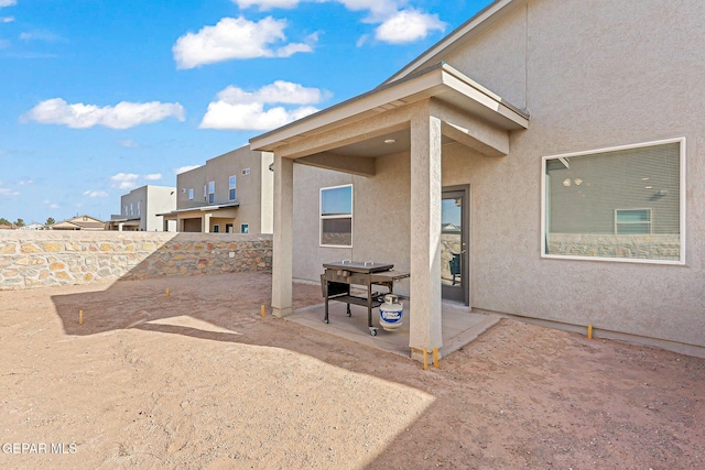 view of patio / terrace featuring fence