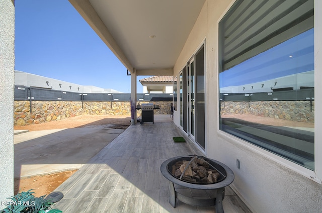 view of patio featuring an outdoor fire pit