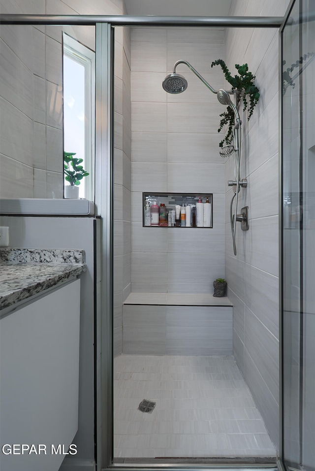 full bathroom with a shower stall