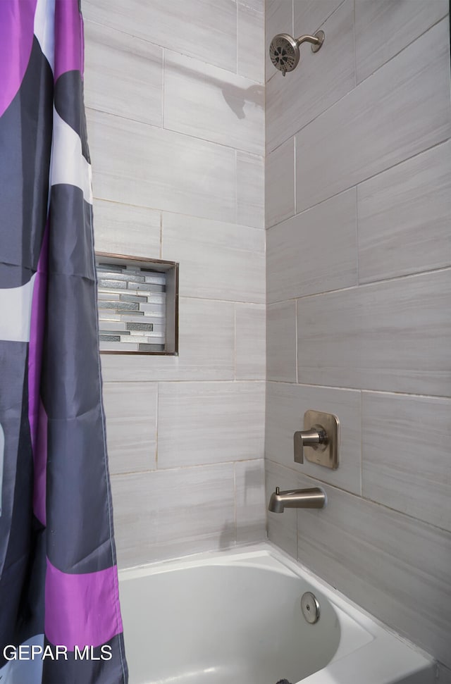 bathroom featuring shower / tub combo