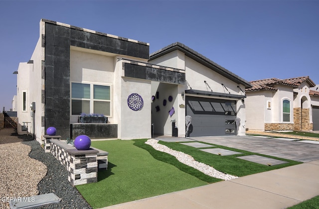 view of front of property featuring a tile roof, concrete driveway, stucco siding, stone siding, and an attached garage