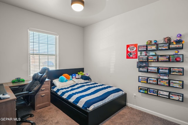 carpeted bedroom with baseboards