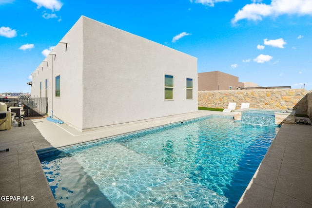 view of pool featuring a fenced in pool and fence