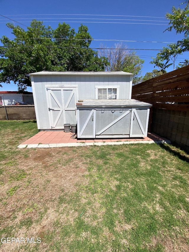view of shed with a fenced backyard