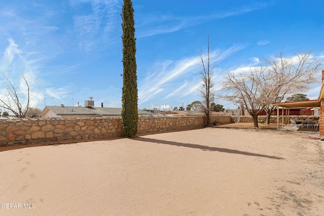 view of yard featuring a patio, central AC unit, and fence