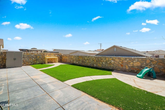 view of yard with a patio area and a fenced backyard