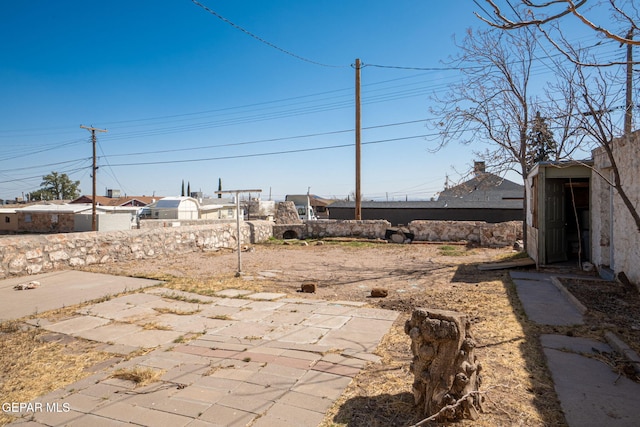 view of yard with fence and a patio area