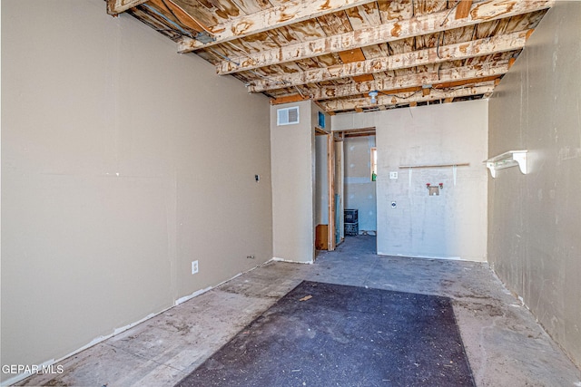 unfinished basement featuring visible vents