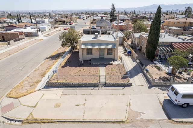 drone / aerial view featuring a residential view and a mountain view