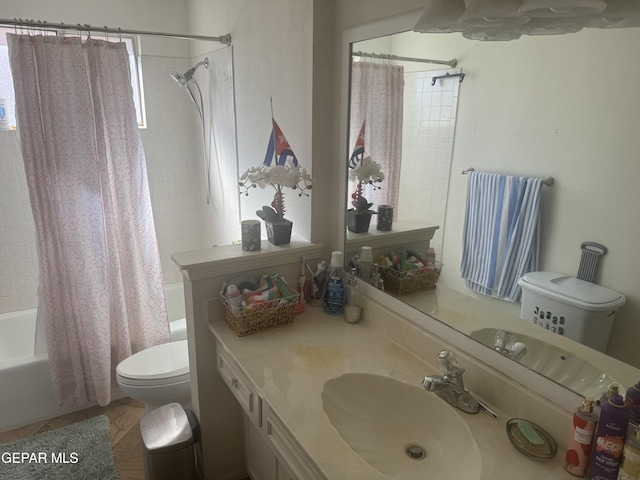 bathroom with shower / bath combo with shower curtain, toilet, and vanity