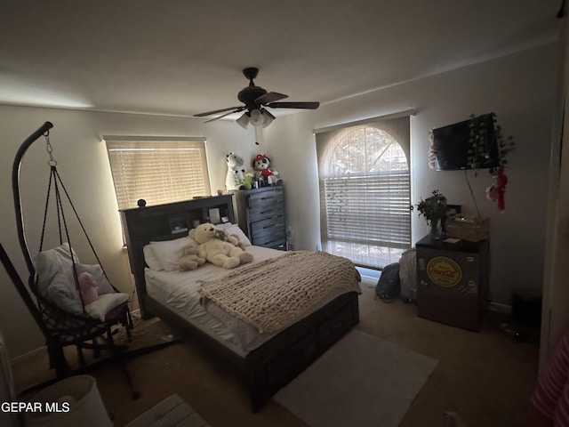 carpeted bedroom with a ceiling fan