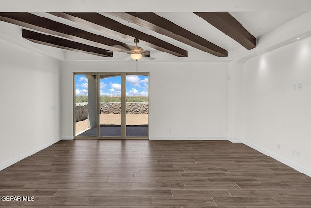 spare room featuring beamed ceiling, baseboards, and dark wood-style flooring