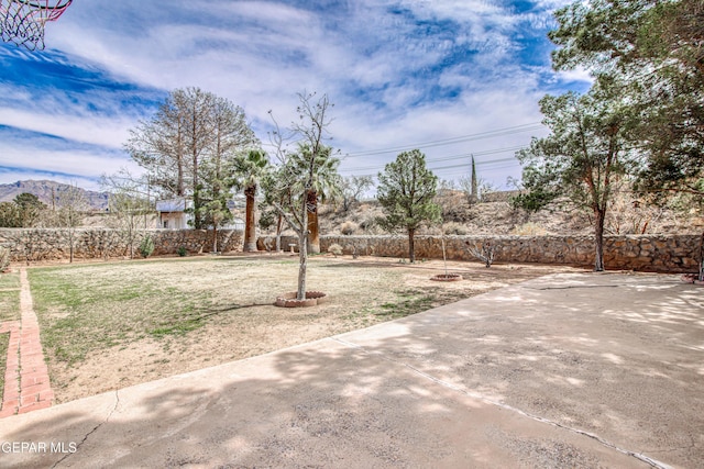 view of yard featuring a patio area and fence