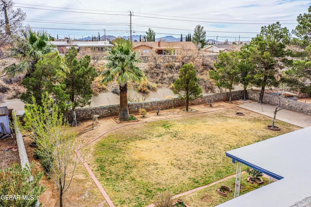 view of yard with an outdoor fire pit and a patio