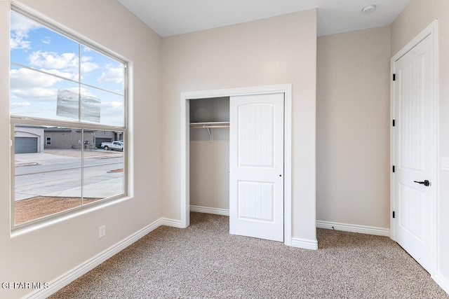 935 Bromyard Dr, Horizon City, TX 79928 - unfurnished bedroom with a closet, baseboards, and carpet floors